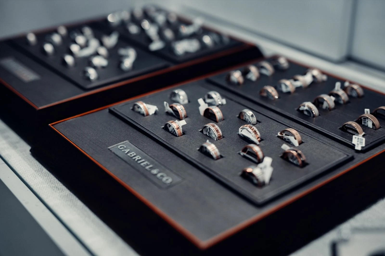 Collection of engagement rings displayed on velvet trays